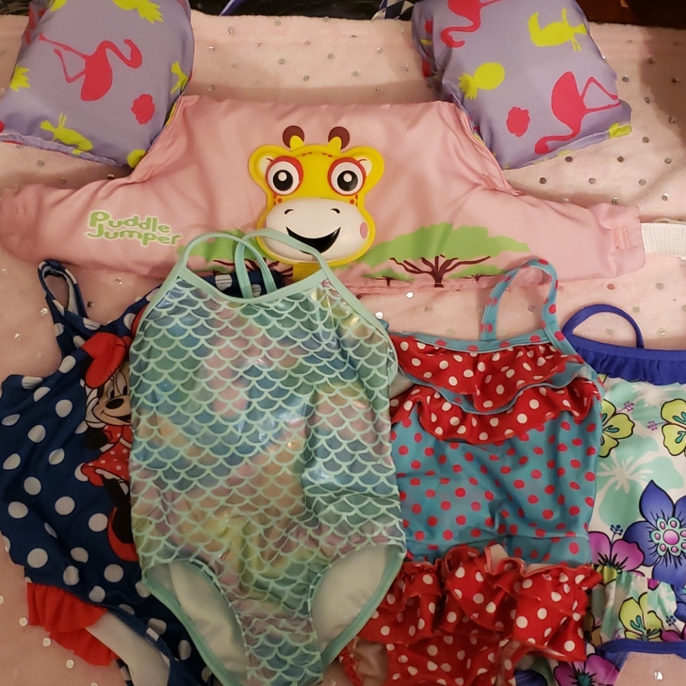 Four 3T bathing suits + life vest